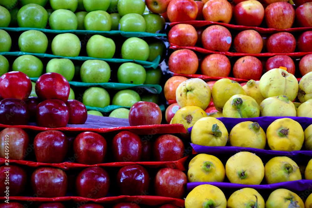 Fresh quince fruit and apples at the food market Fresh quince fruit and apples at the food market