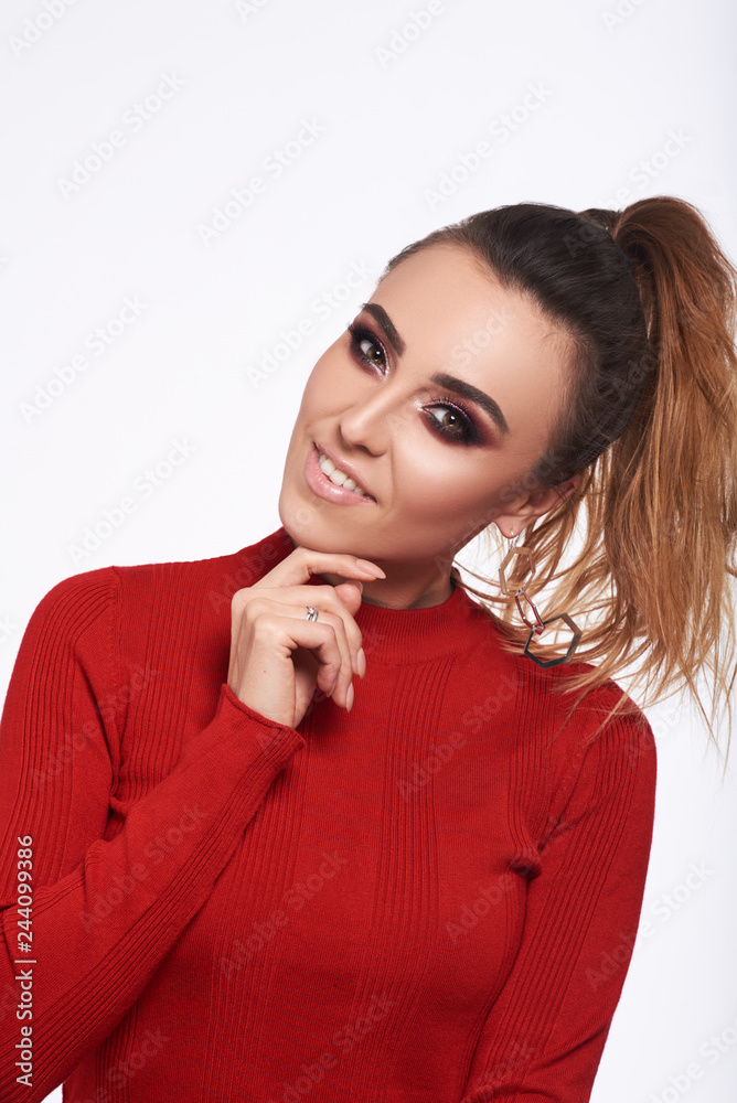 Happy cheerful young woman wearing in red jacket at positive news or birthday gift, looking at camera with joyful and charming smile. Red lips,skin,teeth. Love concept Happy cheerful young woman wearing in red jacket at positive news or birthday gift, looking at camera with joyful and charming smile. Red lips,skin,teeth. Love concept