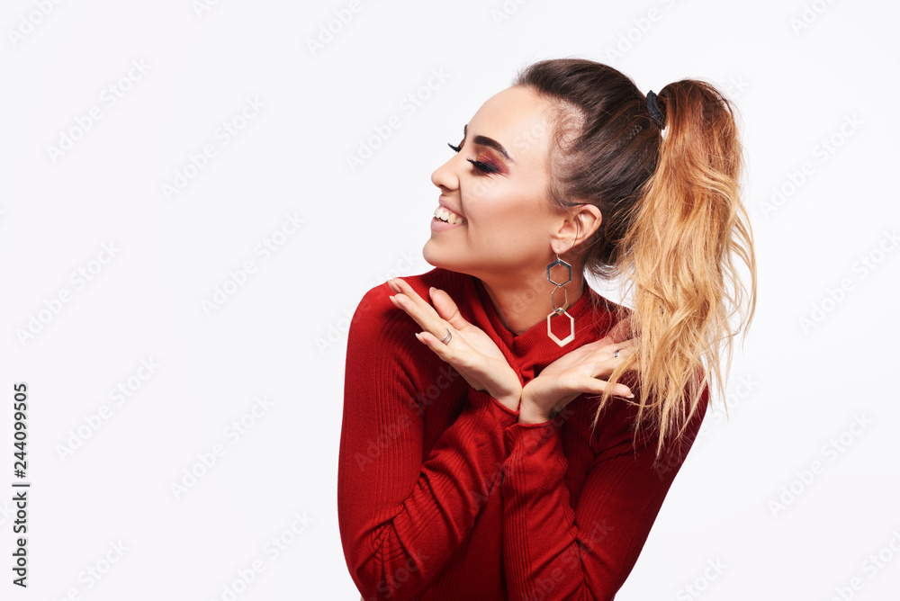 Happy cheerful young woman wearing in red jacket at positive news or birthday gift, looking at camera with joyful and charming smile. Red lips,skin,teeth. Love concept Happy cheerful young woman wearing in red jacket at positive news or birthday gift, looking at camera with joyful and charming smile. Red lips,skin,teeth. Love concept