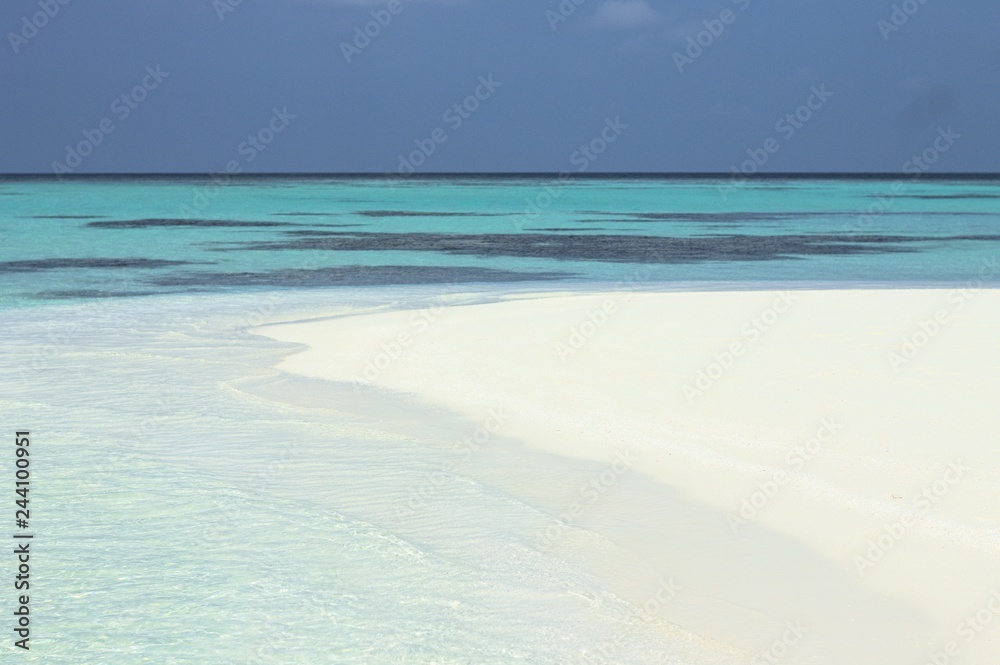 Beach of a desert island (Ari Atoll, Maldives)