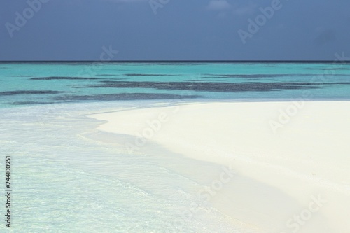 Beach of a desert island (Ari Atoll, Maldives)
