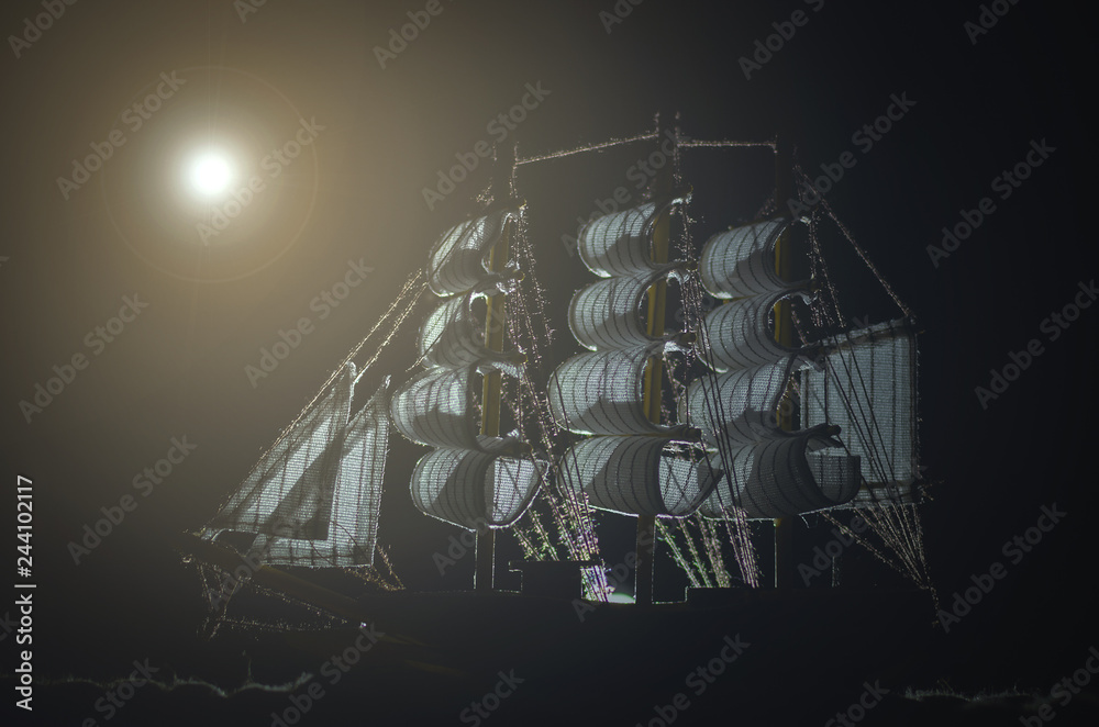 Pirate ghost ship in a night sea background.