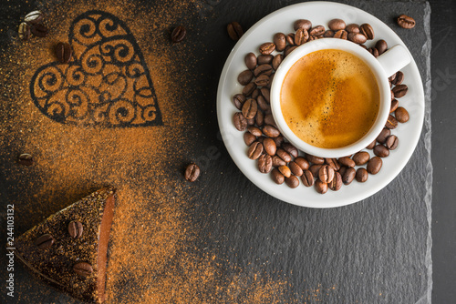 Chocolate cake and espresso coffee on a slate background.