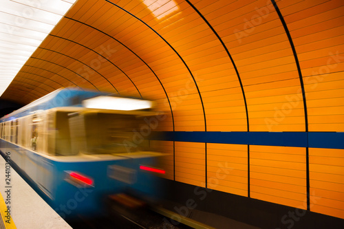 Underground train leaving platform in Munich, Germany