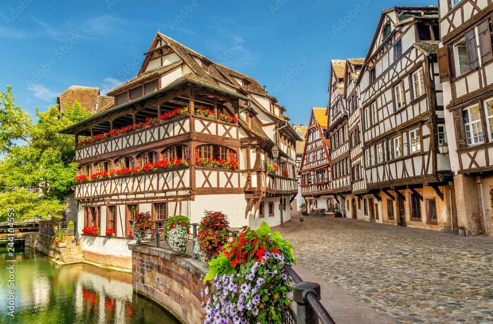 Little France (La Petite France), a historic quarter of the city of Strasbourg in eastern France. Charming half-timbered houses. Famous Maison de Tanneurs house. - obrazy, fototapety, plakaty 