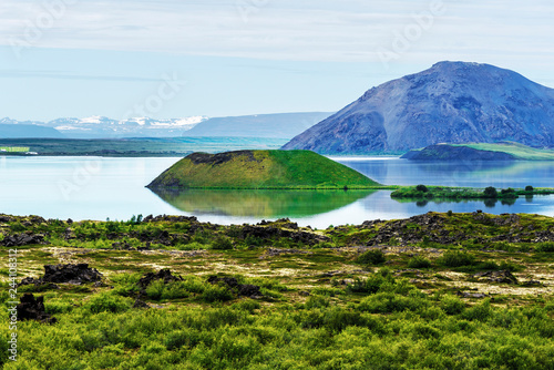Landscape of Myvatn lake in Northern Iceland. Islet of volcanic pseudo crater is a middle. photo