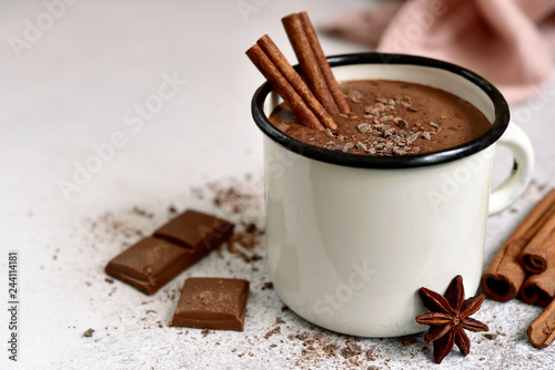 Homemade hot chocolate in a white enamel mug.