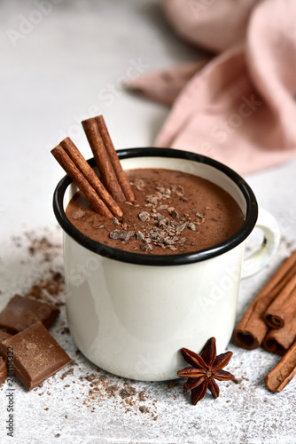 Homemade hot chocolate in a white enamel mug.