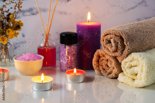 Spa treatment set with scented salt  candles  towels and aroma oil
