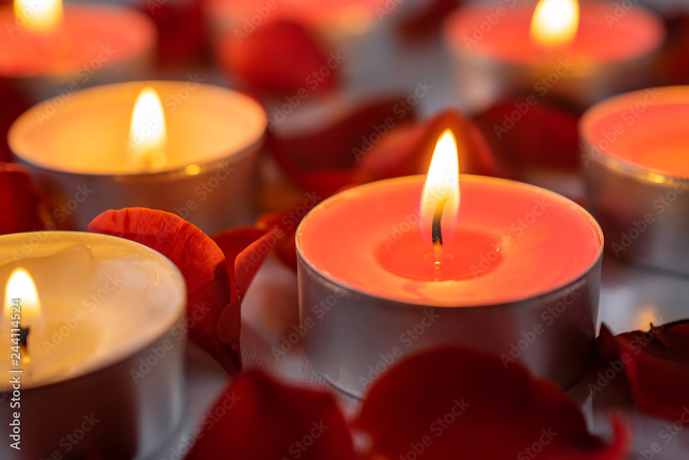 Scented candles with rose petals, warm and cozy background Scented candles with rose petals, warm and cozy background