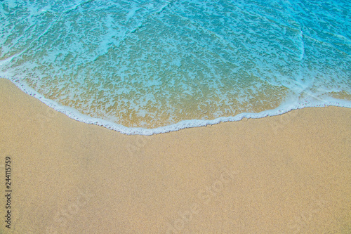 Soft waves on the sandy beach.