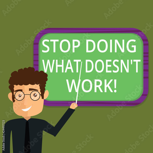 Writing note showing Stop Doing What Doesn T Work. Business photo showcasing Make changes to make things successfully happen Man Standing Holding Stick Pointing to Wall Mounted Blank Color Board