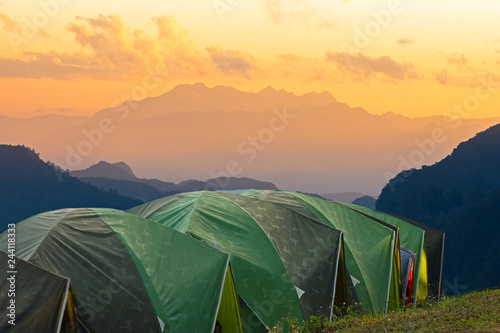 Adventures Camping tourism and tent ,view forest landscape , outdoor in morning and sunset sky at Mon Sone View point , Doi Pha Hom Pok National Park in Chiang Mai,North Thailand. Concept Travel. © nopporn