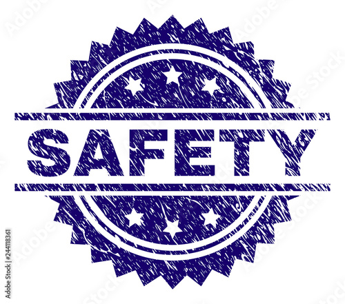 SAFETY stamp seal watermark with distress style. Blue vector rubber print of SAFETY caption with unclean texture.