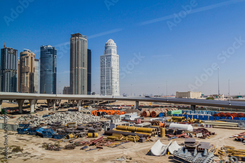 Canvas Print Skyscrapers and a construction site in Dubai, United Arab Emirates