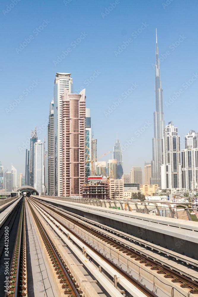 Tracks of an elevated stretch of Dubai metro and Burj Khalifa skyscraper, United Arab Emirates