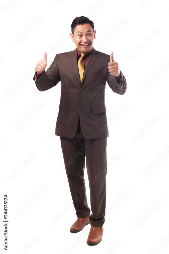 Young Asian Businessman Shows Thumbs Up Gesture Young Asian Businessman Shows Thumbs Up Gesture