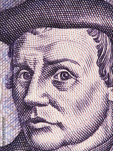 Thomas Muntzer on East German 5 mark (1975) banknote close up macro. Leading German radical Reformer during the Protestant Reformation. . photo