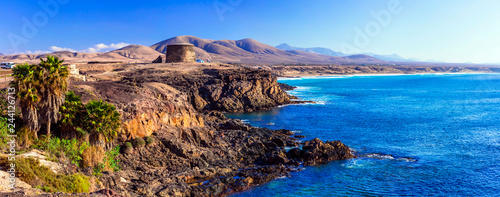 landscapes of volcanic Fuerteventura - view with Toston tower in El Cotillo. Canary islands photo