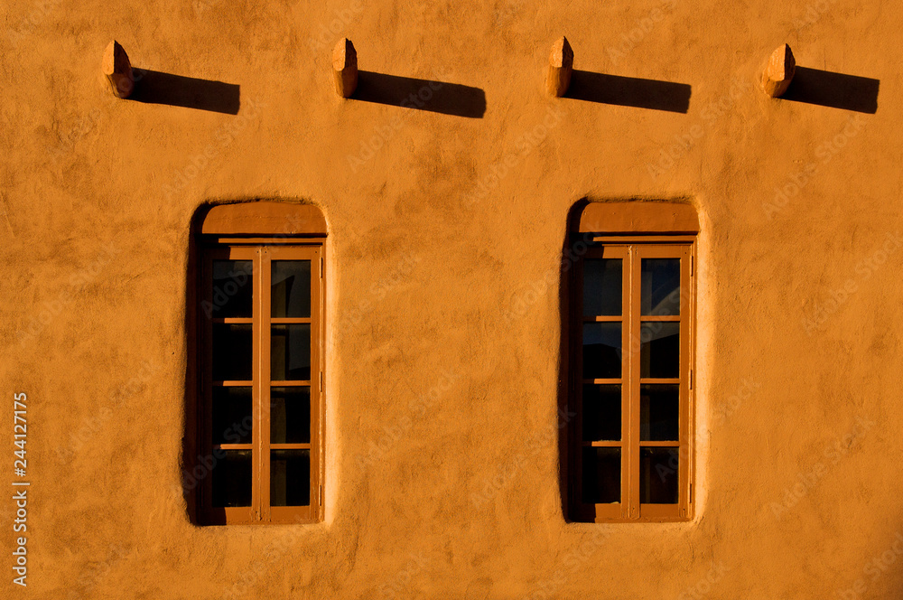Fototapeta premium Windows, Viga’s casting shadows and Adobe Walls, Santa Fe, New Mexico 