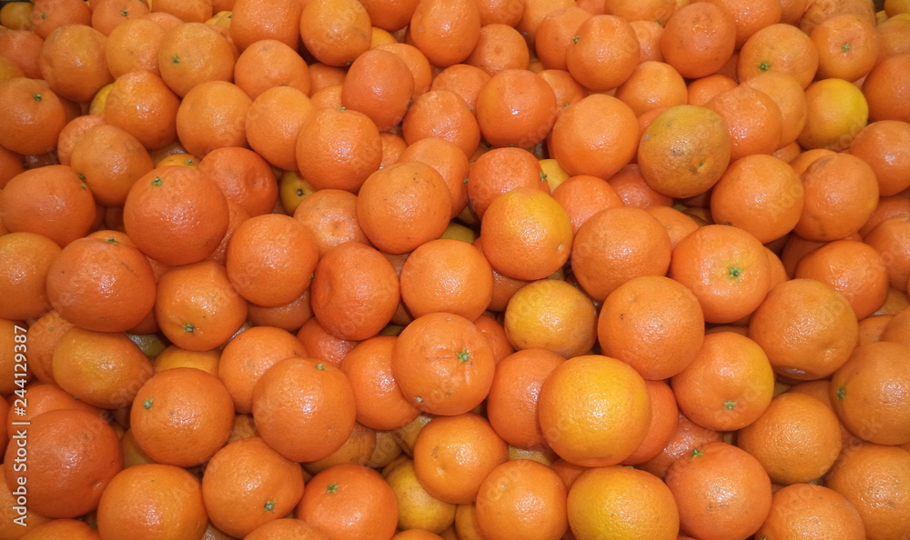 a bunch of fresh ripe tangerines