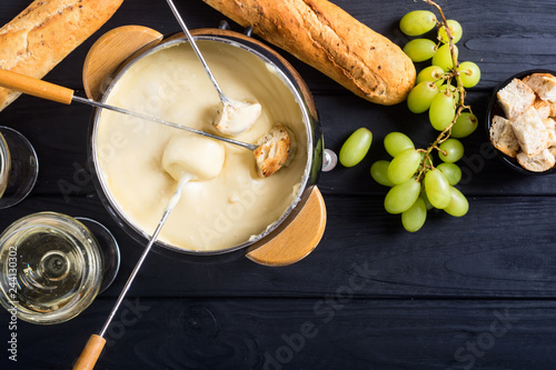Cheese fondue with bread wine and grape