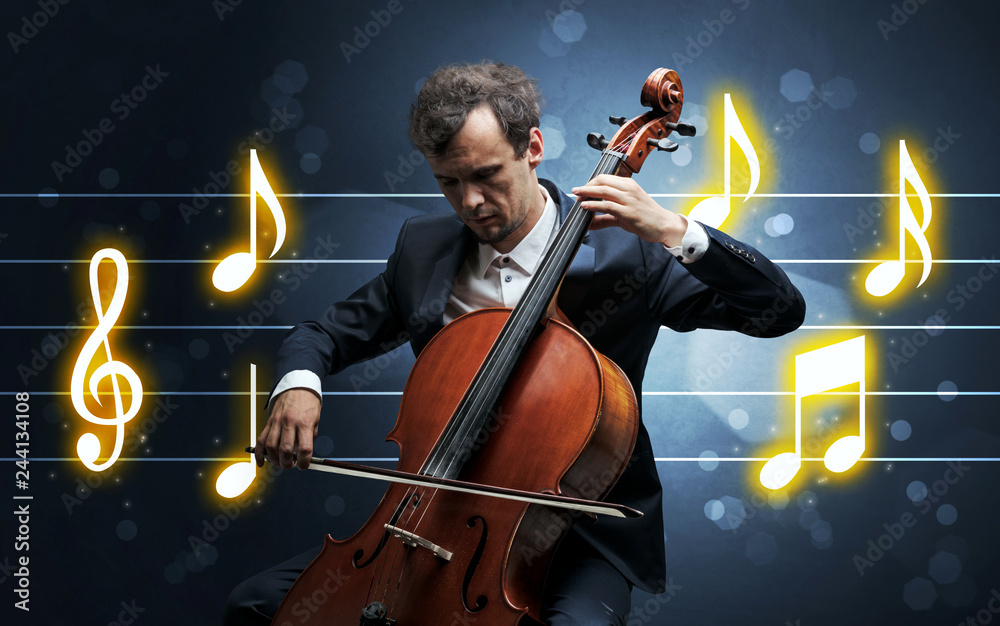 Fototapeta premium Young handsome cellist playing with music sheet background