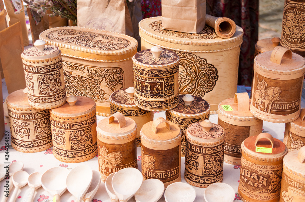 Russia, Khabarovsk, August 18, 2018: birch bark dishes and wooden spoons Russia, Khabarovsk, August 18, 2018: birch bark dishes and wooden spoons