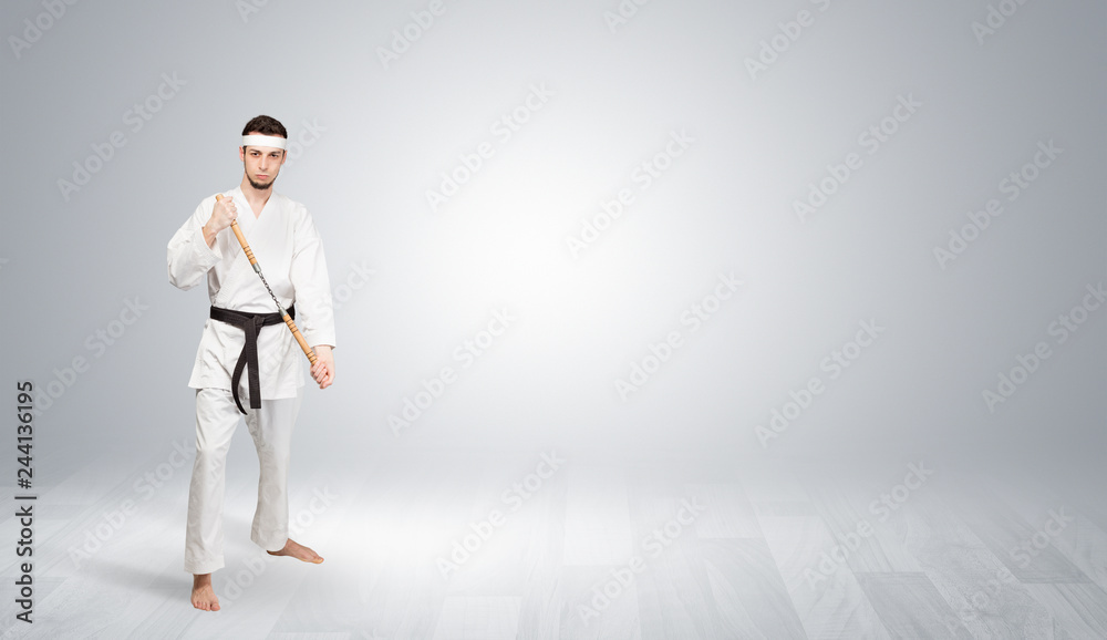 Young kung-fu trainer fighting in an empty space
Young kung-fu trainer fighting in an empty space