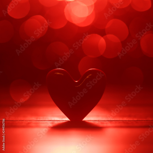 Single heart and red bokeh abstract background