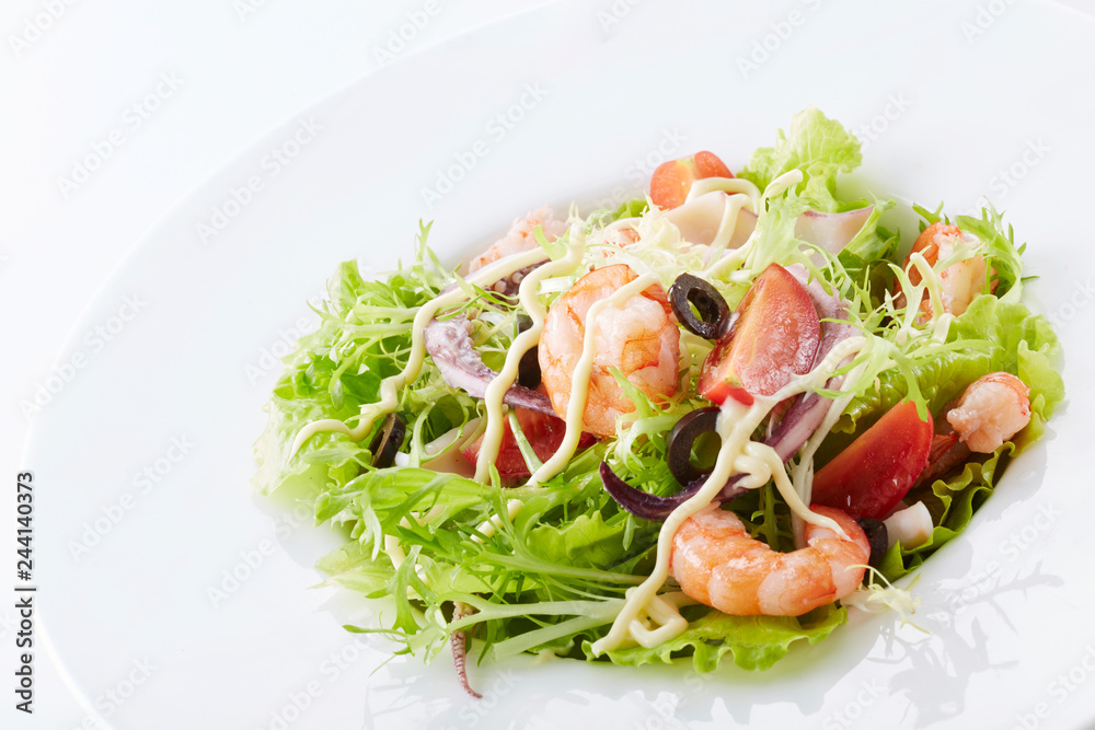 Delicious seafood salad on a white background Delicious seafood salad on a white background