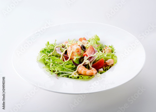 Delicious seafood salad on a white background