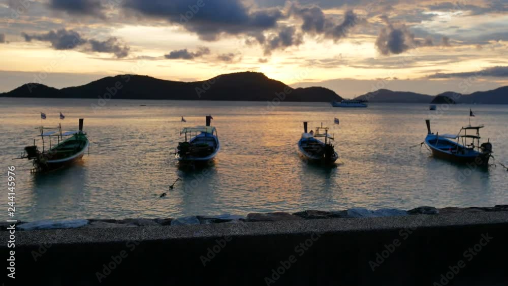 concrete ground floor and blur moving long tail boat in the sea , reflection in water, silhouette mountain cloudy sky background, put your product on cement floor concrete ground floor and blur moving long tail boat in the sea , reflection in water, silhouette mountain cloudy sky background, put your product on cement floor