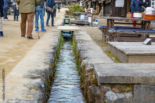 福島日光街道宿場町大内宿の茅葺屋根と自然用水の水路 photo