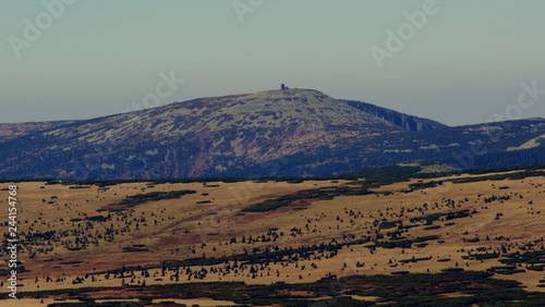 Fototapeta Naklejka Na Ścianę i Meble -  The trip in the Giant Mountains, a view of the Wielki Szyszak in the distance, a shelter on the top of the hill