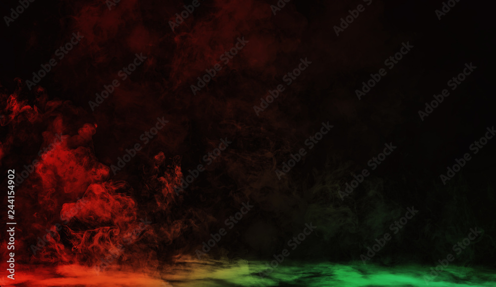 Fototapeta premium Abstract red vs green smoke steam moves on a black background . The concept of aromatherapy