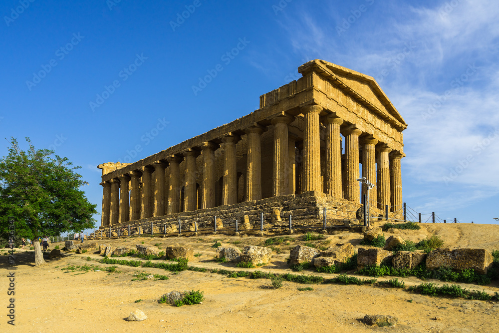 Side view of the Temple of Concordia lighted by late afternoon sunset, Valle dei Templi (Valley of the Temples), Agrigento, Sicily, Italy