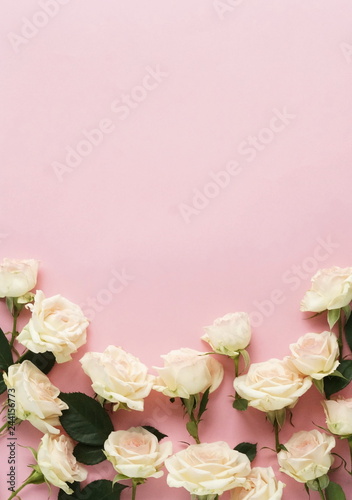 Flowers composition background. beautiful pale pink roses on pale pink background.Top view.Copy space