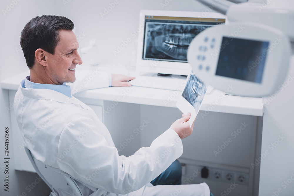 Pleased brunette male person wearing medical uniform Pleased brunette male person wearing medical uniform