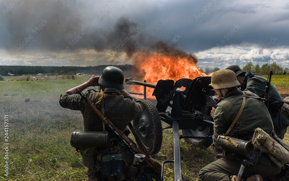 Shooting german artillery gun in the battle during World war II