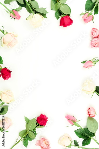 Flowers background. Border frame of beautiful pink and red roses on white background. Holiday background. Top view.Copy space