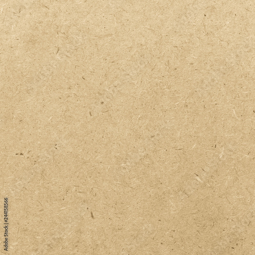 Particle pressed wood panel osb oriented strand board texture pattern background in light beige cream yellow gold color