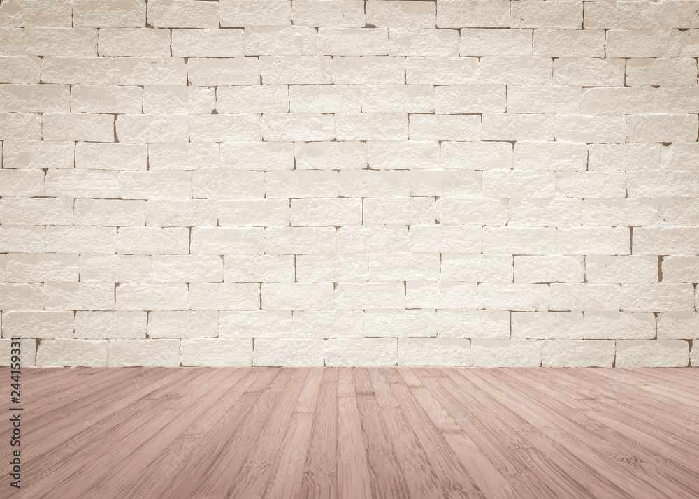 Brick wall painted in cream beige color with wooden floor textured background in natural red brown
