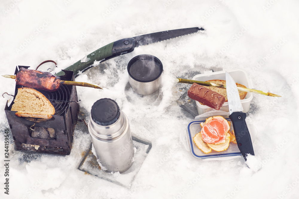 Firebox stove and grilled sausage. Picnic fishing. Firebox stove and grilled sausage. Picnic fishing.
