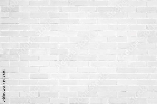 Brick wall texture pattern background in natural light white grey