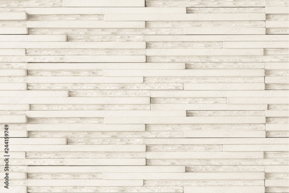 Fototapeta premium Granite tiled wall detailed pattern texture background in natural light creme beige color