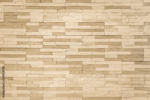 Brick tile wall pattern background in light yellow gold brown color