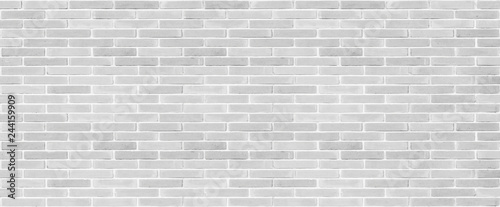 Long brick wall texture background in white grey color