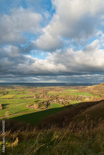 Beautiful Autumn Fall landscape of South Downs National Park in English countryside in late afternoon light