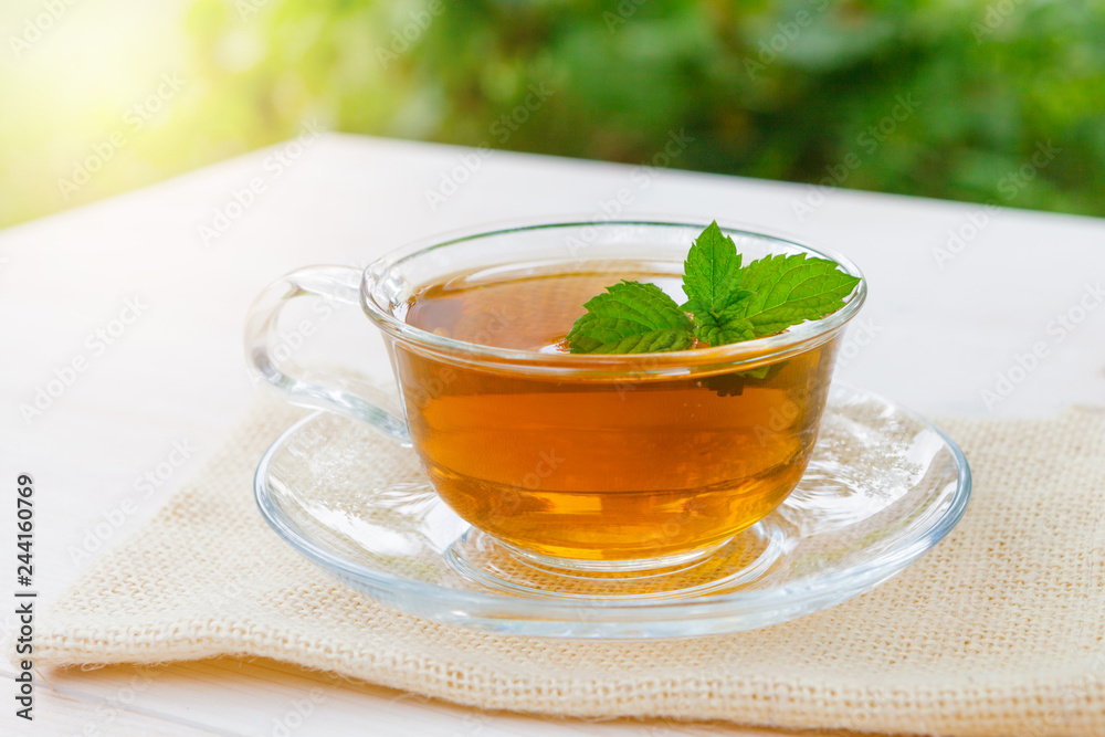 A Cup of tea on a wooden table. A Cup of tea on a wooden table.